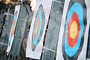 Bullseye target paper, outdoor and field at shooting range for weapon training, aim and accuracy. Sports, archery and