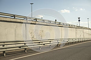 Bump stop near highway. Wall on highway. Strassa exit