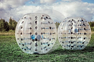 Bumper-balls for soccer playing on a green lawn