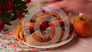 Bun with cinnamon on the table still life strainer apples