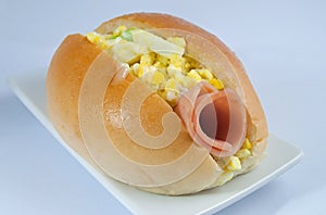 Bun with egg mayonnaise and ham