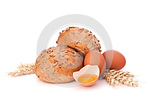 Bun with seeds and broken egg