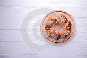 Bun on a white background with space for text. Russian national bread Kalach