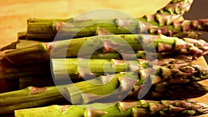 Bunch of asparagus close up on wooden board