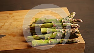 Bunch of asparagus close up on wooden board
