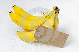 Bunch of bananas with blank paper tag