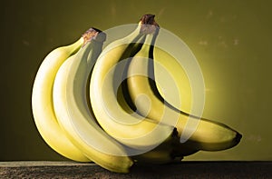Bunch of bananas on a green background
