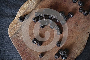 A bunch of blackberries on the cutting board