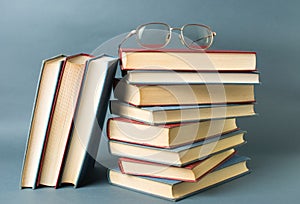 Bunch of books and reading glasses