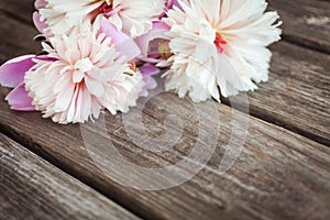 Bunch, bouquet of pink peonies on a wooden background. Frame of flowers