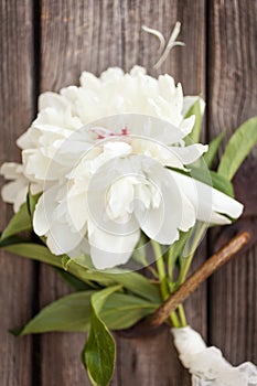 Bunch, bouquet of pink peonies on a wooden background. Frame of flowers