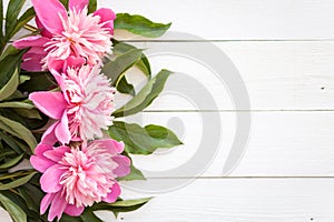 Bunch, bouquet of pink peonies on a wooden background. Frame of flowers