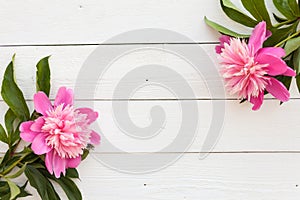 Bunch, bouquet of pink peonies on a wooden background. Frame of flowers