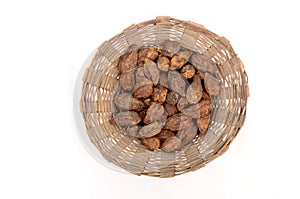 Bunch the brown color drilled ha red fruit in the basket isolated on white background