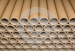A bunch of brown industrial paper core. A lot of paper cores or paper tubes.