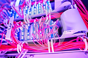 Bunch of cables in server rack with illumination