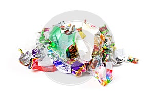 A bunch of candy wrappers on a white background. Closeup