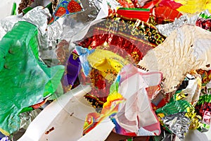 A bunch of candy wrappers on a white background. Closeup