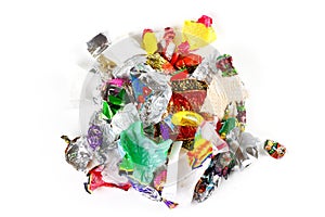 A bunch of candy wrappers on a white background. Closeup