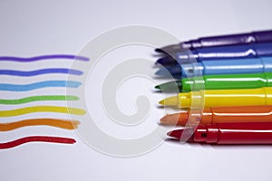 A bunch of colored markers laid out in rainbow order. stationery concept. copy space. isolated