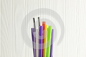 Bunch of colored plastic straws isolated on white background close up. Ban single use plastic campaign
