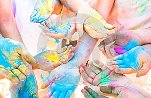 Bunch of colorful hands of friends group having fun at beach party