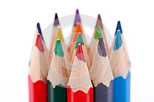 Bunch of colourful pencil crayons on white