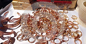 Bunch of cooper rings and bracelets