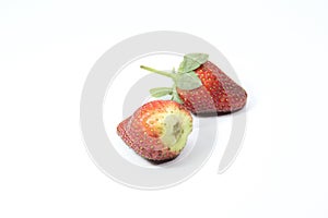 a bunch of creatively arranged strawberries with a white background. selective focus