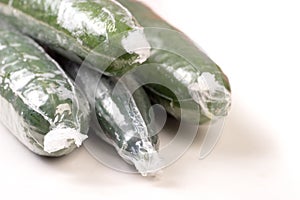 Bunch of cucumber wrapped in plastic films