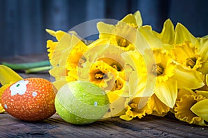 Bunch of daffodils with easter eggs for Easter