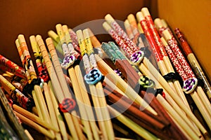 bunch of decorated bamboo chopsticks for oriental food