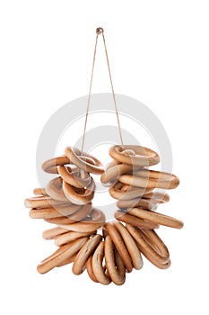 Bunch of delicious ring shaped Sushki dry bagels on white background