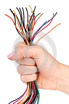 Bunch of different colored wires gripped in fist