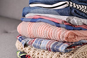 Bunch of different colorful clothing items folded in stack