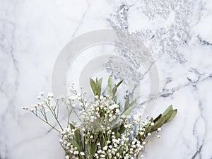 Bunch of dried flowers and eucaliptus branches on marble background