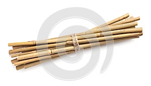 Bunch of dry bamboo sticks on white background, top view