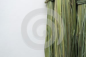 Bunch of dry green lemongrass on a white background