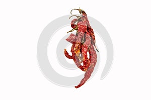 Bunch of dry hot red chili peppers isolated on a white background