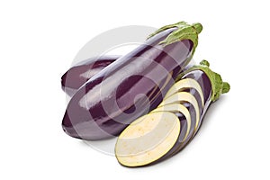 A bunch of eggplant, one sliced in half, isolated on white background. Clipping path