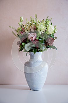 Bunch of elegant flowers in vase as love or Valentines day attribute