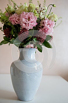 Bunch of elegant flowers in vase as love or Valentines day attribute