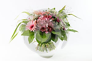 A bunch of flowers with Gerberas, roses and hydrangeas on white background