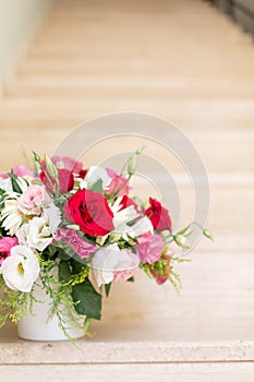 Bunch of flowers in reusable vase delivered to the addressee