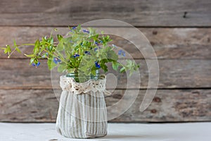 Bunch of forget-me-nots on wooden background. Greeting card for Valentine`s day,Mother`s Day, 8 March