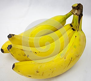 A bunch of four banana, bananas on white background