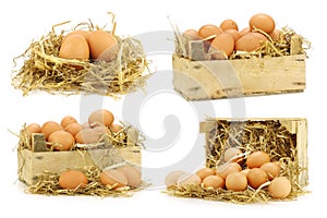 Bunch of fresh brown eggs and some straw in a wooden crate