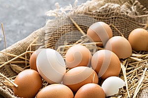 Bunch of fresh brown eggs in a wooden crate