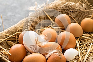 Bunch of fresh brown eggs in a wooden crate