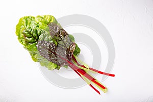 Bunch of fresh chard leaves on white background. Top view